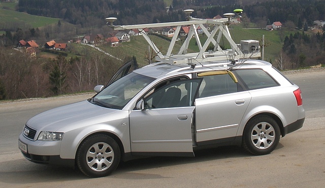 This picture shows a car carrying the platform of the institute with 4 GNSS antennas and receivers and different kinds of inertial measurement units