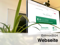 Monitor mit offener EnInnov2024-Webseite mit Pflanze welche in den Monitor hineinragt.