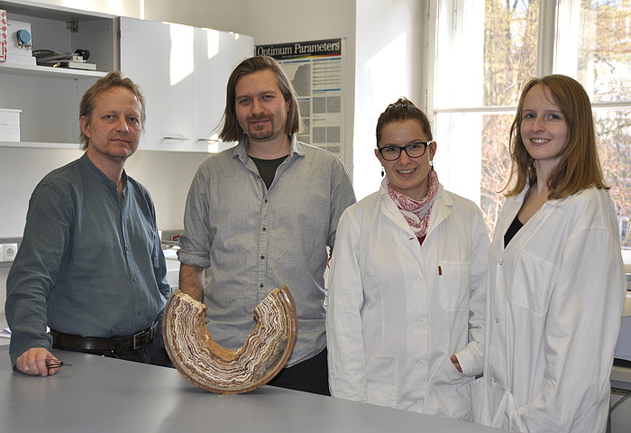 Prof. Martin Dietzel, Dr. Ronny Boch, Anna Gollowitsch and Marlene Sakoparnig in a laboratory at the Institute of Applied Geosciences at TU Graz. 