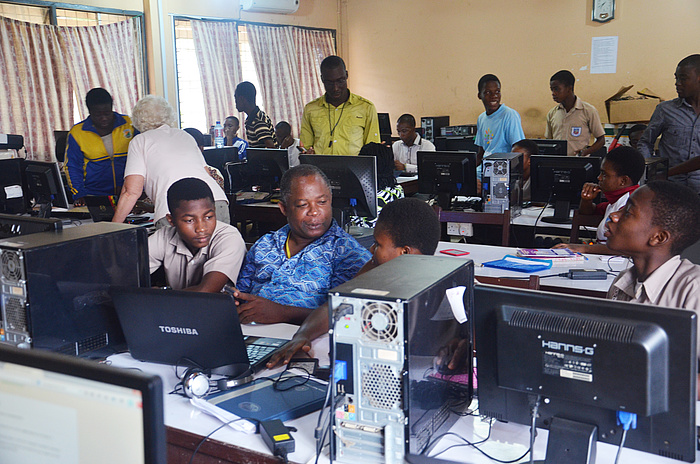 Workshop participants of various ages in the well-equipped computer lab at KETASCO.
