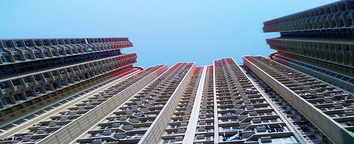 Picture of split-system air conditioning units on the façade of a residential high-rise in Kowloon, Hong Kong.