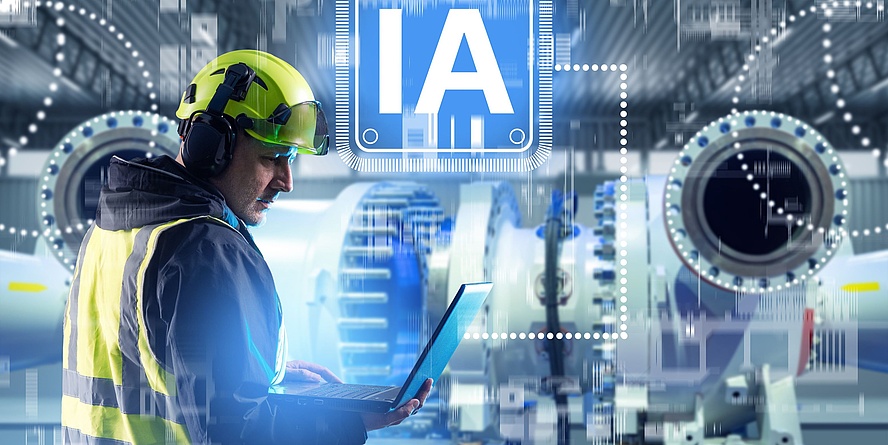 Ingenieur, der in einer modernen Fabrik einen Laptop mit KI verwendet