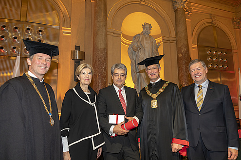 Group of people in festive attire and gown