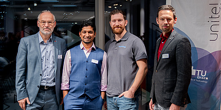 Group photo of Stefan Vorbach, Vice Rector for Academic Affairs at Graz University of Technology, and the founders of MUST Visibility FlexCo and AutonimIQ, smiling for the camera.