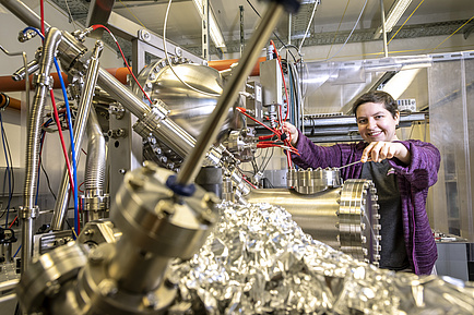 A woman in a physics laboratory