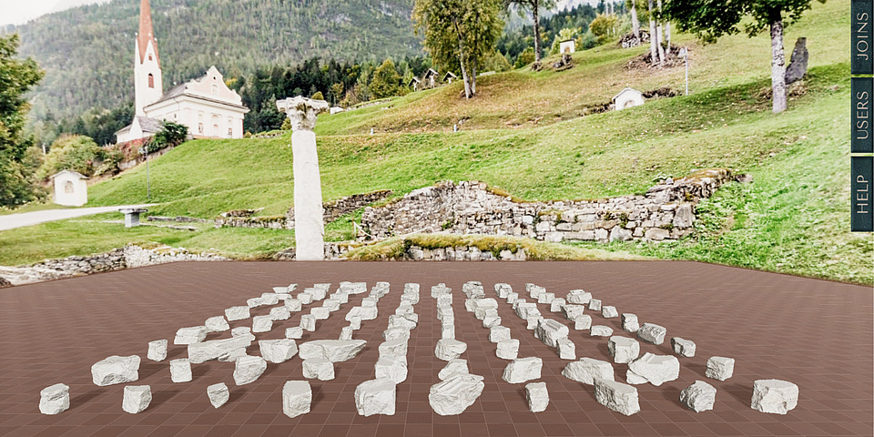 The virtual fragments of the altar plate lie on the floor, with the archaeological site in Lavant in the background.