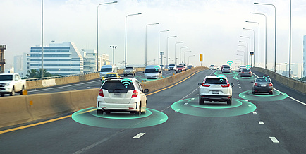 Cars with signal waves drawn in on urban motorway