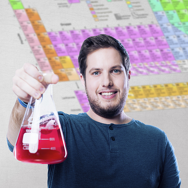 Student with a laboratory glass in his hand