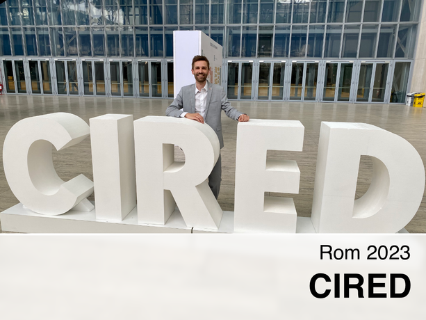 Robert Gaugl behind a big CIRED logo.