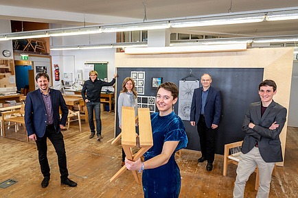 Six people in the TU Graz furniture workshop