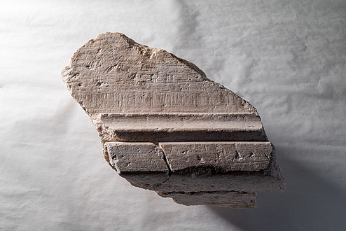 A fragment of an altar stone.