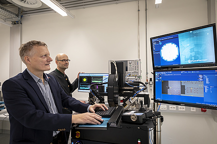 Researchers in front of Computers and Monitors