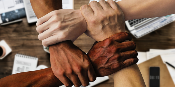 4 hands of different skin colour