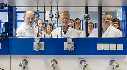 A group of people in lab coats