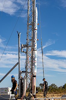 The ISPIDA rocket during launch preparations. Image source: ASTG A rocket stands in its launch pad.