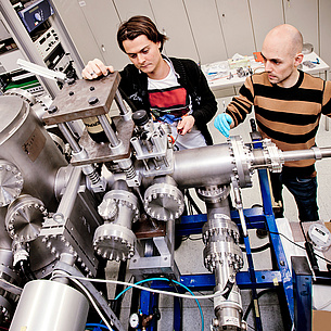 Two men operating a machine. Photo source: Lunghammer - NAWI Graz