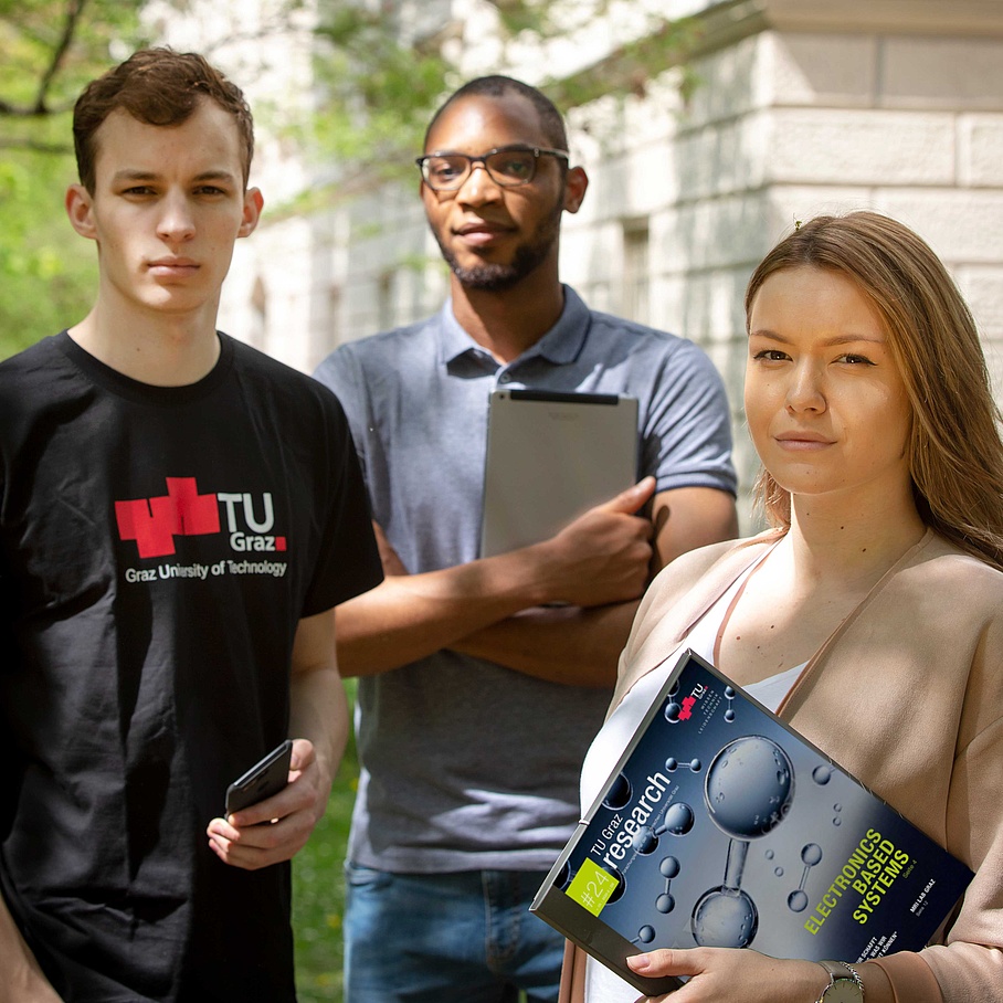 3 people with a magazine, a tablet and a smartphone