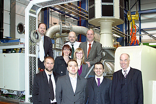 Participants of the pretest meeting of the EU project DREAM in front of the turbine test facility at the institute.