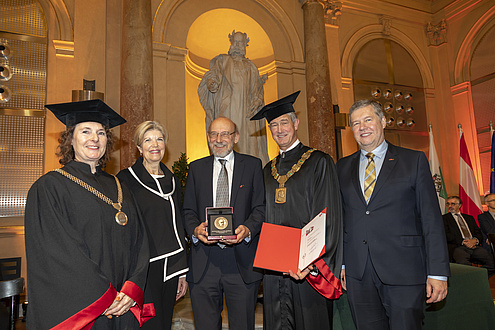 Group of people in festive attire and gown