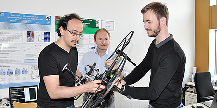 Jesus Pestana Puerta, Friedrich Fraundorfer and Michael Maurer are preparing the drone for the flight.