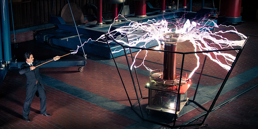 Actor dressed up as Nikola Tesla in the Nikola Tesla Laboratory.