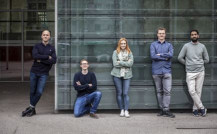 Group picture with four men and a woman