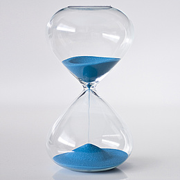 Sandglass filled with blue sand. Photo source: xaviersarrent – fotolia.com