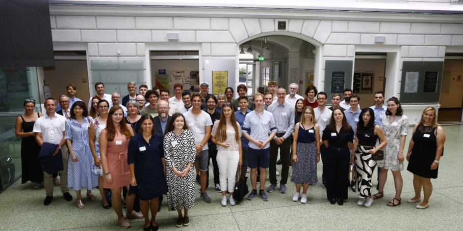 Students and company representatives stand together for a group photo