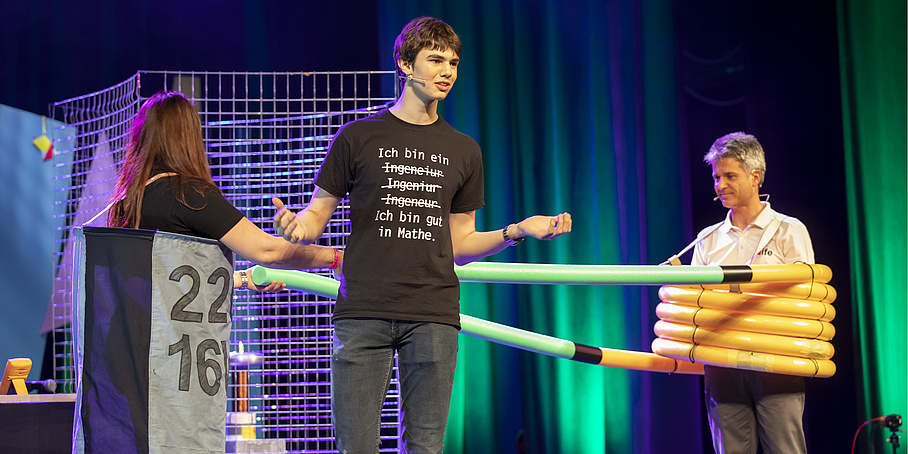 3 people doing a show on a stage