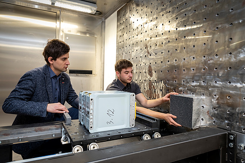 Two engineers working on a crash system 