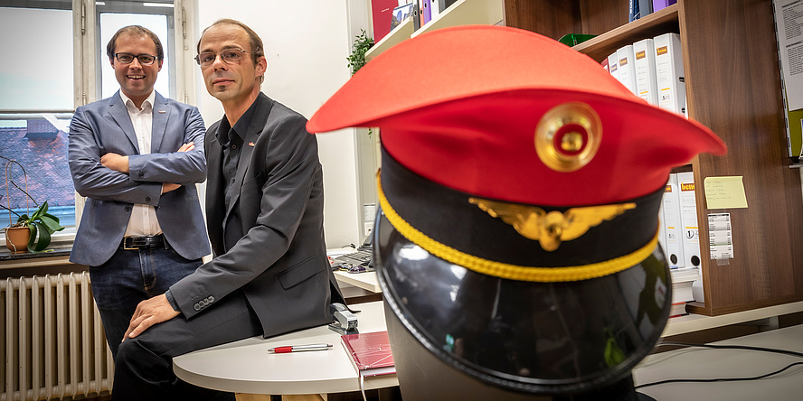 Two TU Graz researchers, in the foreground a conductor's cap