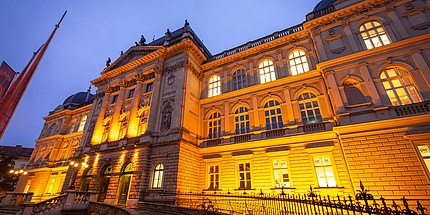 Historic building illuminated in orange