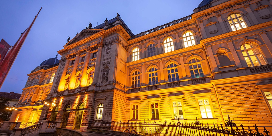 Historic building illuminated in orange