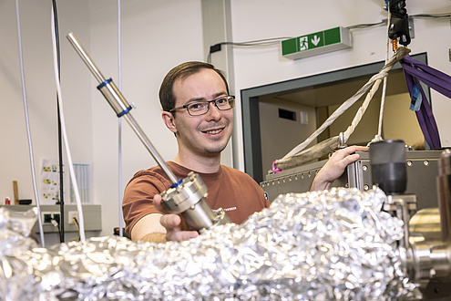 A man in a physics laboratory