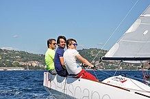 Three men sailing.