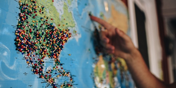 World map with pins. Source: Kelsey Knight – Unsplash.com