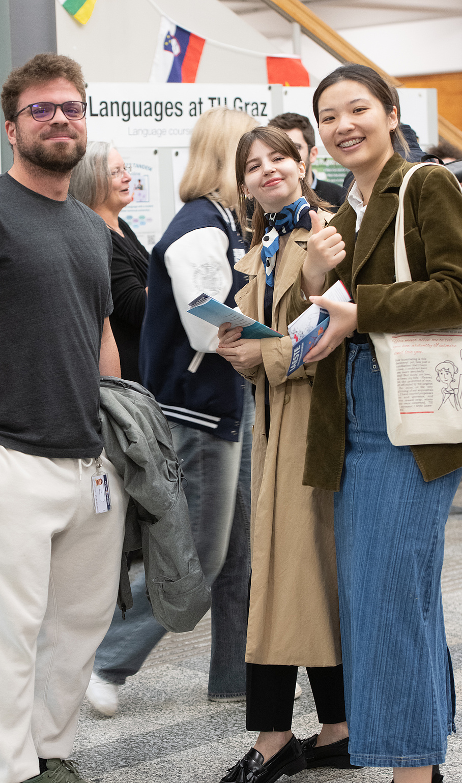 Students smiling and looking at the camera