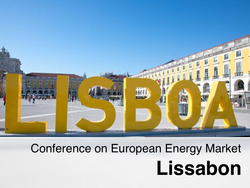In the photo you can see a beautiful yellow older building in the background and the word Lisboa in large yellow letters in front of it.