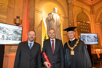 Three gentlemen in festive attire