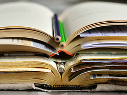 open books with pens and notes