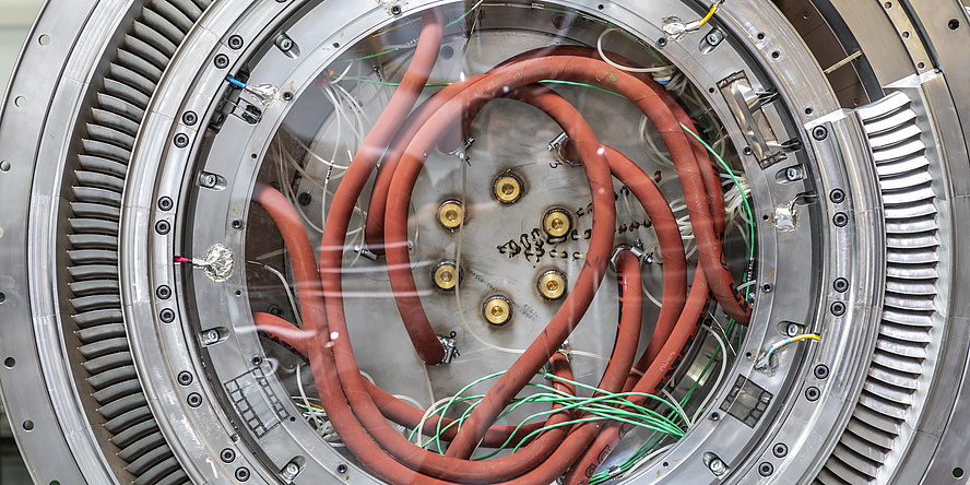  A Turbine Center Frame. A large metallic circle with orange cable.