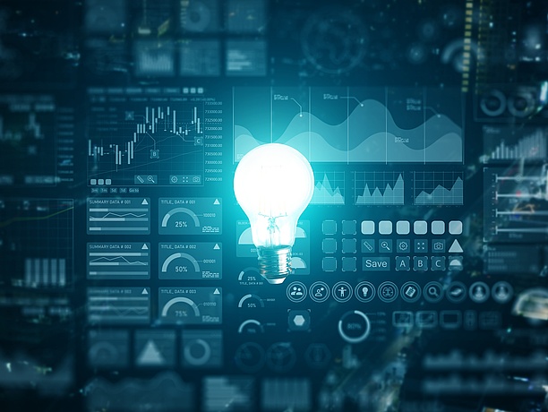 Illuminated,Or,Glowing,Lightbulb,,Blue,Light,,On,Dark,Background,With