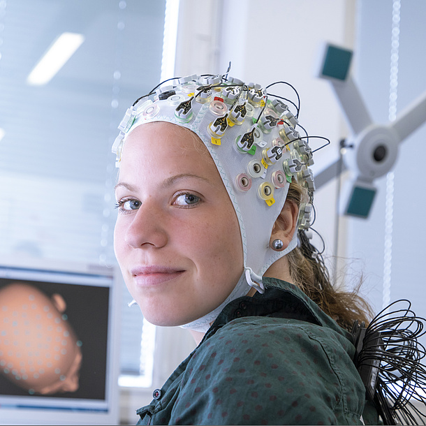 A young woman with electrode cap