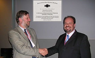 Presentation of the "Best Paper Award" to Dr. Emil Goettlich by Prof. Howard Hodson of Cambridge University, chair of the Turbomachinery Committee, during the ASME IGTI conference 2006 in Barcelona