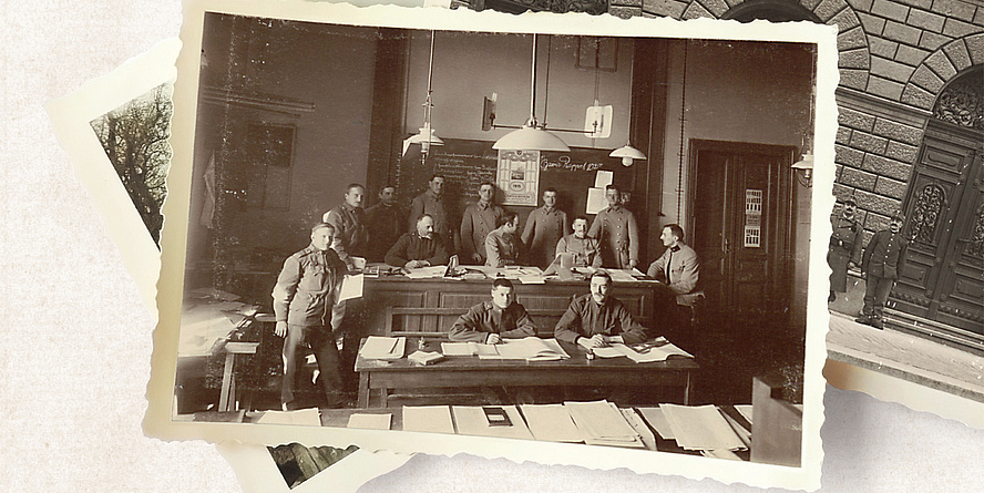 Eine historische Aufnahme von mehreren Männern, die in einem Lehrsaal der TU Graz sitzen