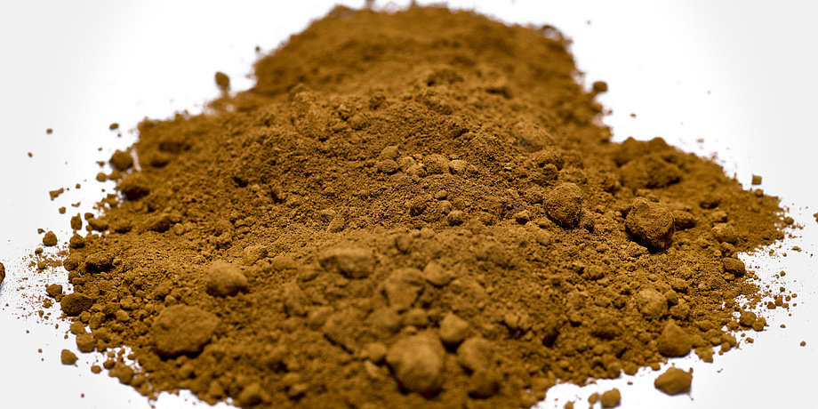 Fine brown powder lies in a pile.