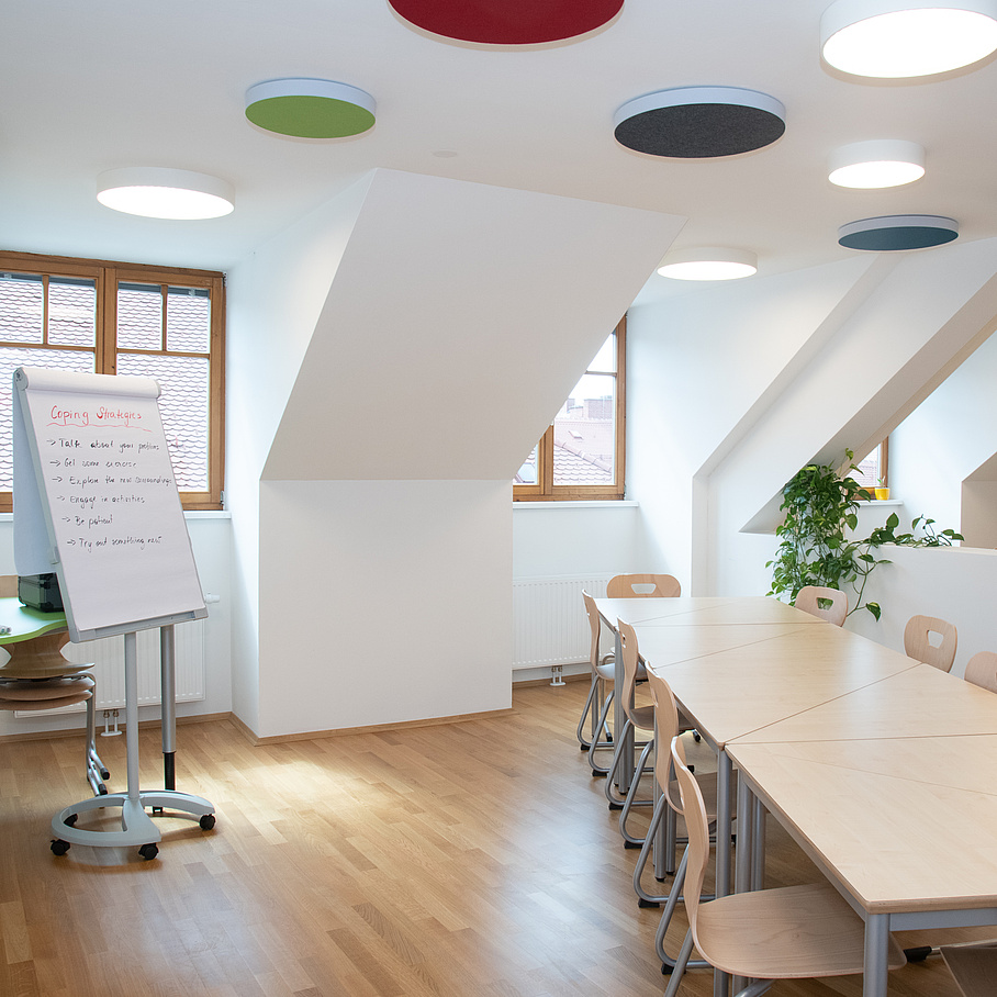 Seminar room with table and flipchart