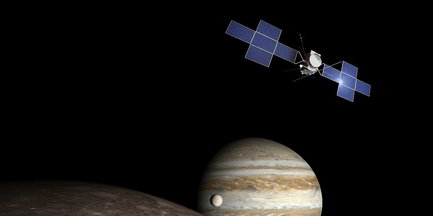 A space probe flies in front of Jupiter