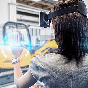 A young woman is wearing virtual reality glasses.