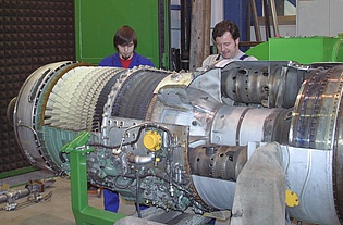 Mr. Turcsanyi and Mr. Preßnitz working on the cut-model of a Svenska Flygmotor RM6C